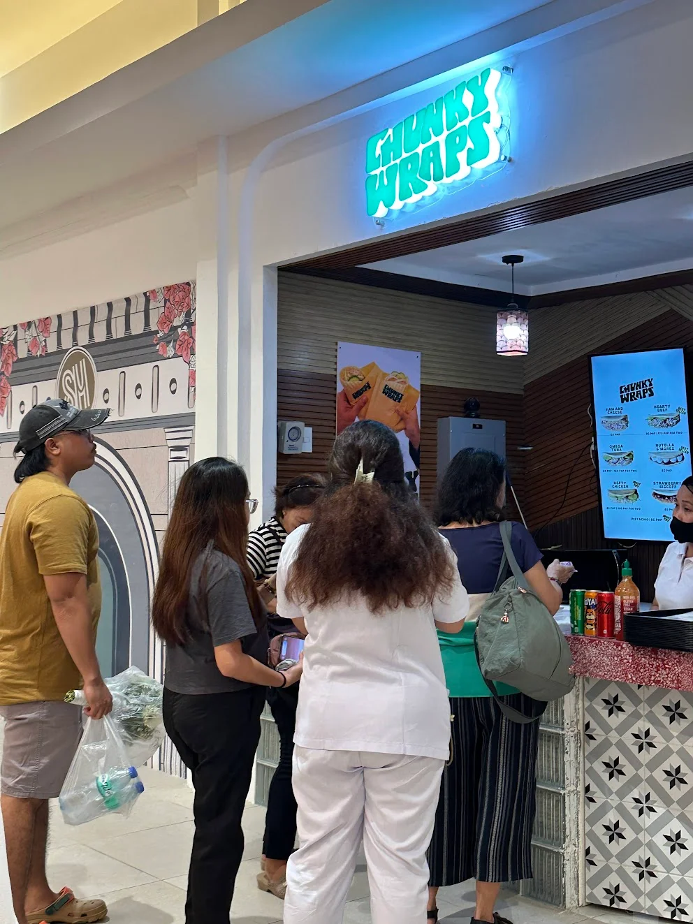 Customers gathered at the Chunky Wraps stall