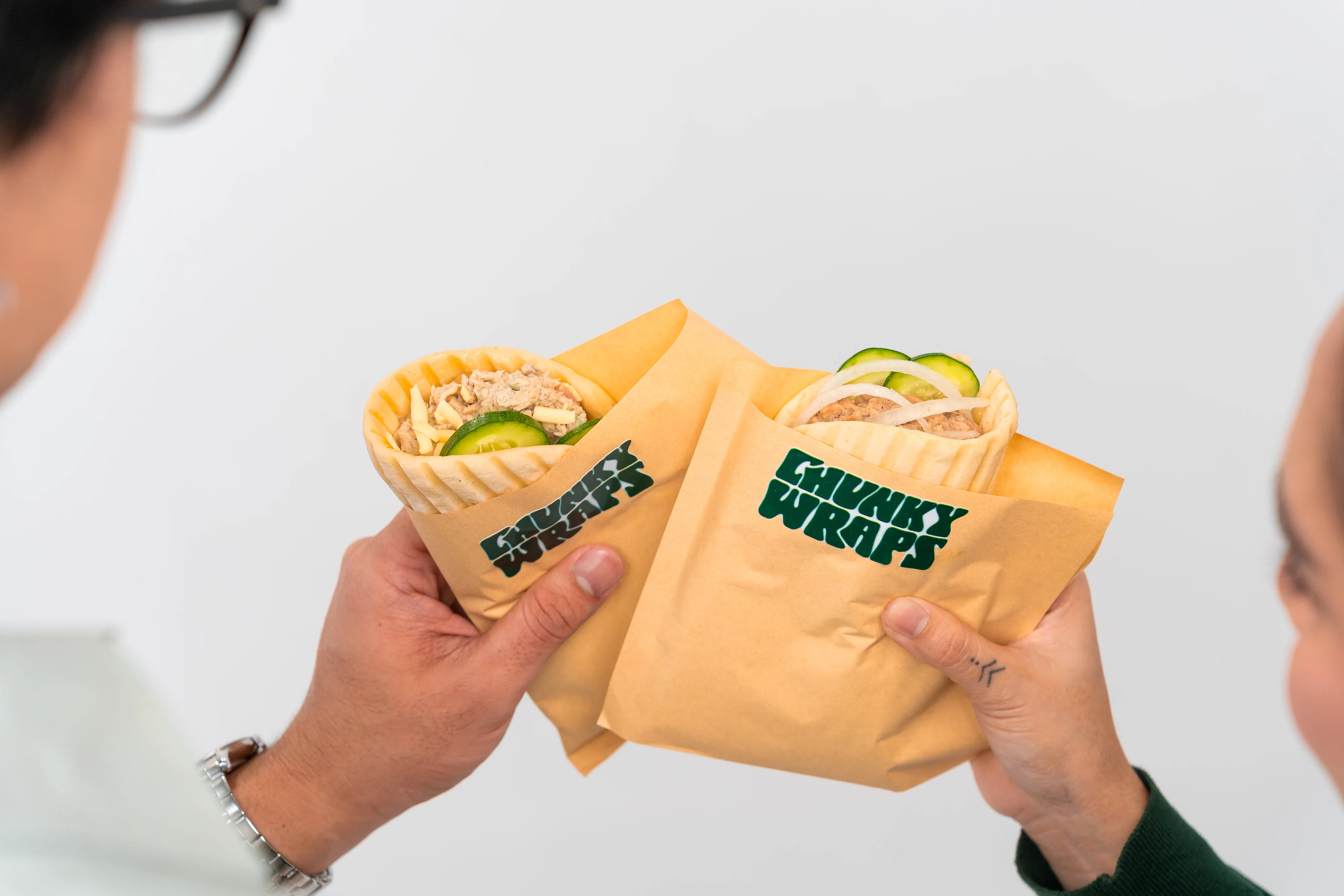 Two Chunky Wraps held up, fresh from the counter